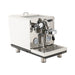 Espresso machine with white body and metallic components on a white background