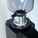 Coffee grinder with clear top and black base on a white background