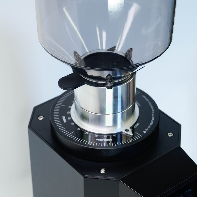 Coffee grinder with clear top and black base on a white background