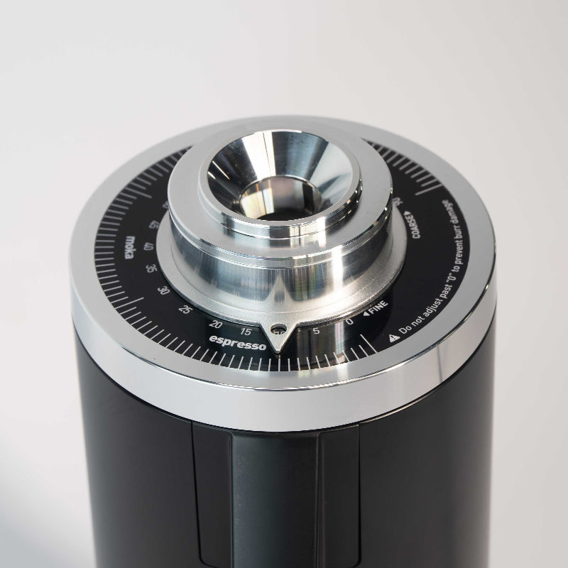 Black and silver coffee grinder on a white background