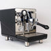 Black espresso machine with chrome accents on a white background