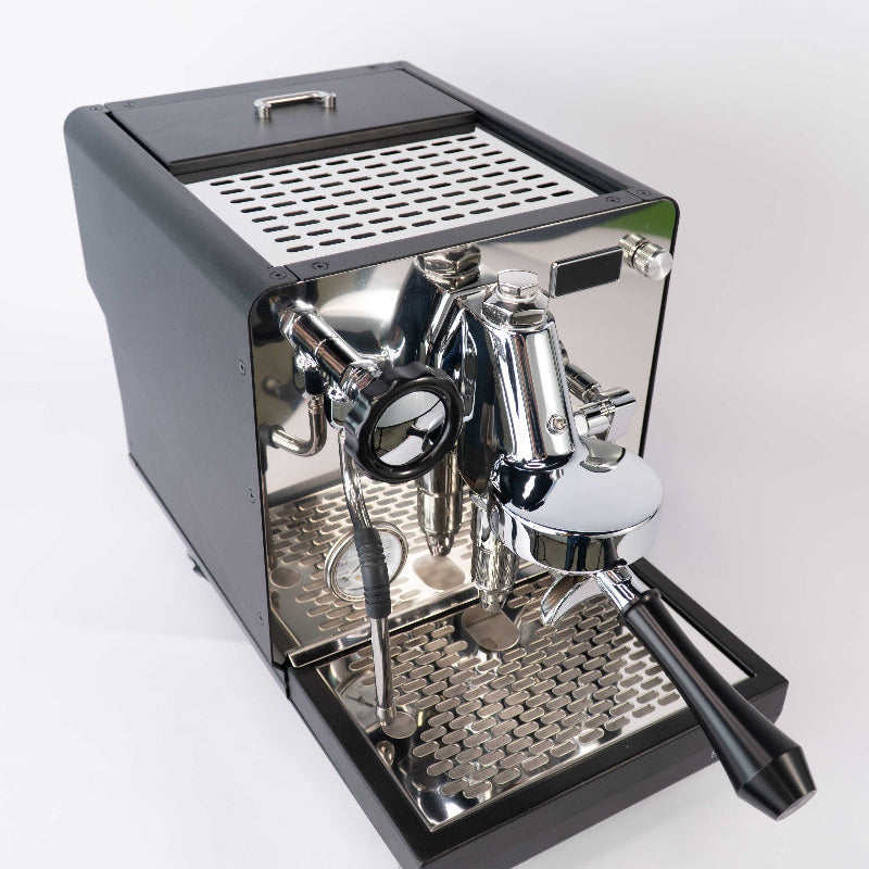 Espresso machine with metallic finish on a white background