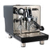 Espresso machine with metallic finish on a white background