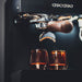 Espresso machine with two glasses of coffee below, featuring the Gaggia brand.