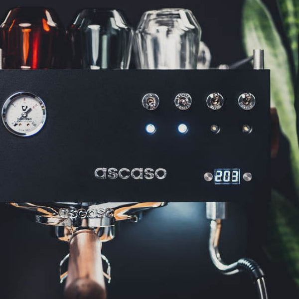 Espresso machine with 'ascaso' branding on a dark background