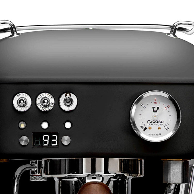 Close-up of a coffee machine with control panel and brand logo