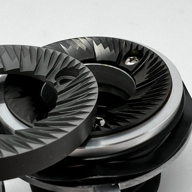 Close-up of a metallic gear system on a white background