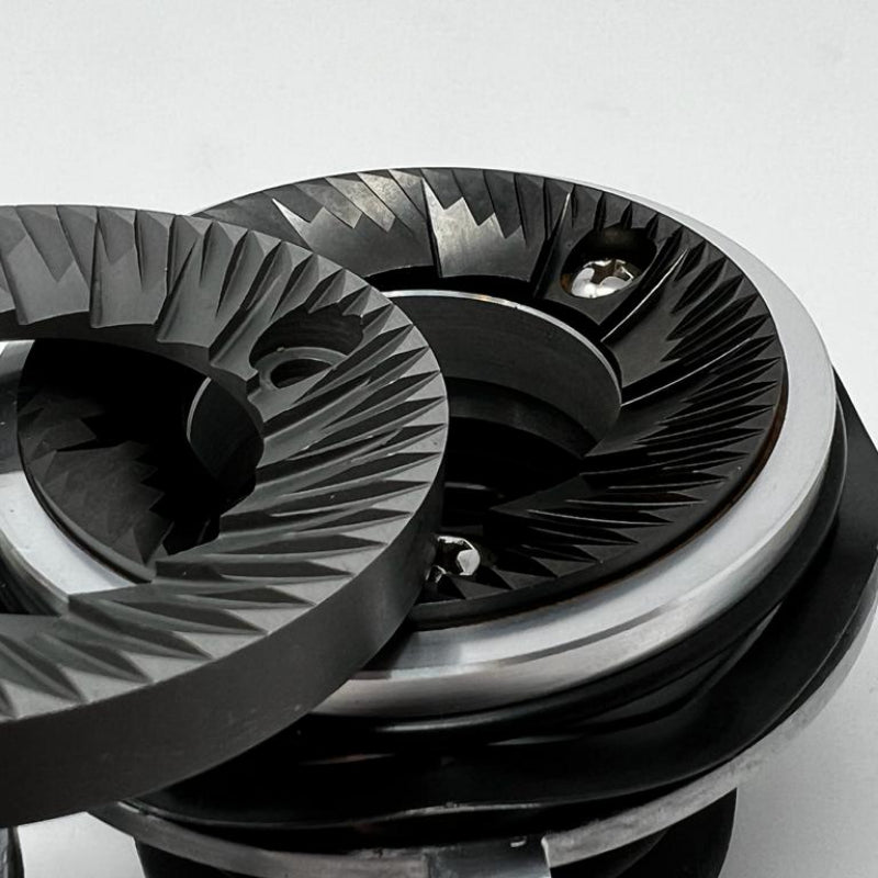 Close-up of a metallic gear system on a white background